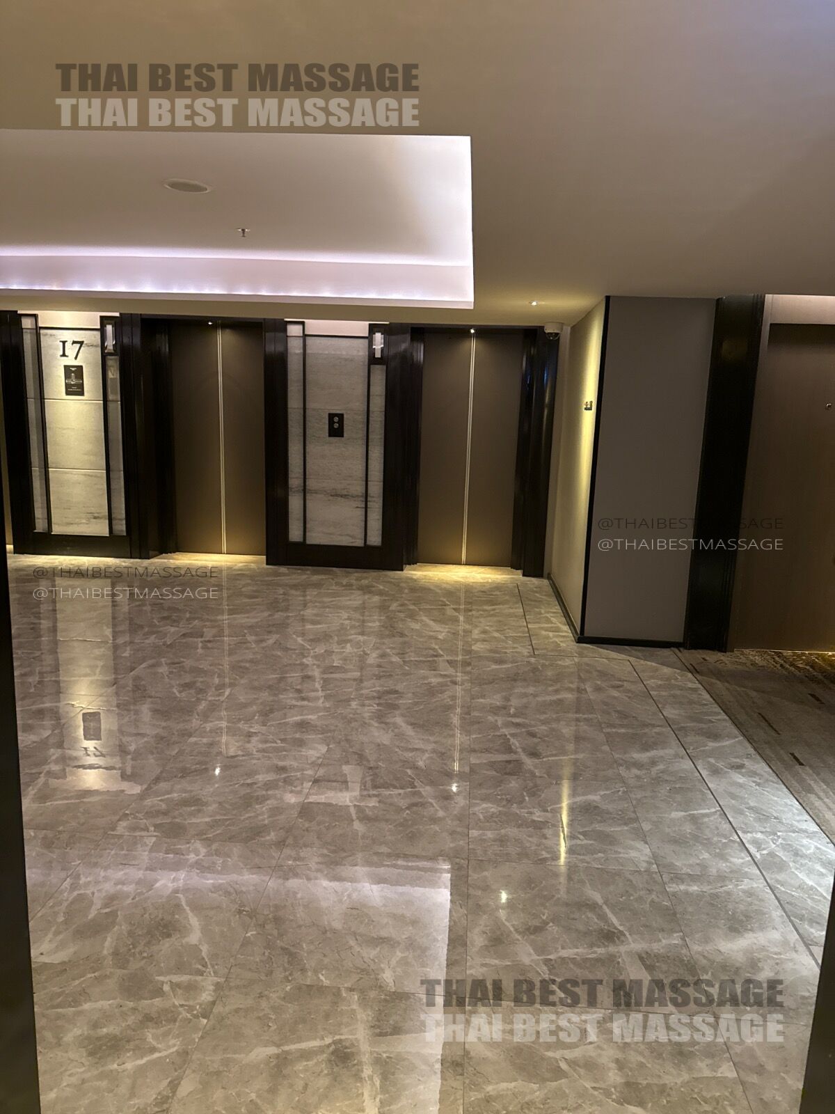 Professional oil massage being performed by therapist Apple on a hotel bed.