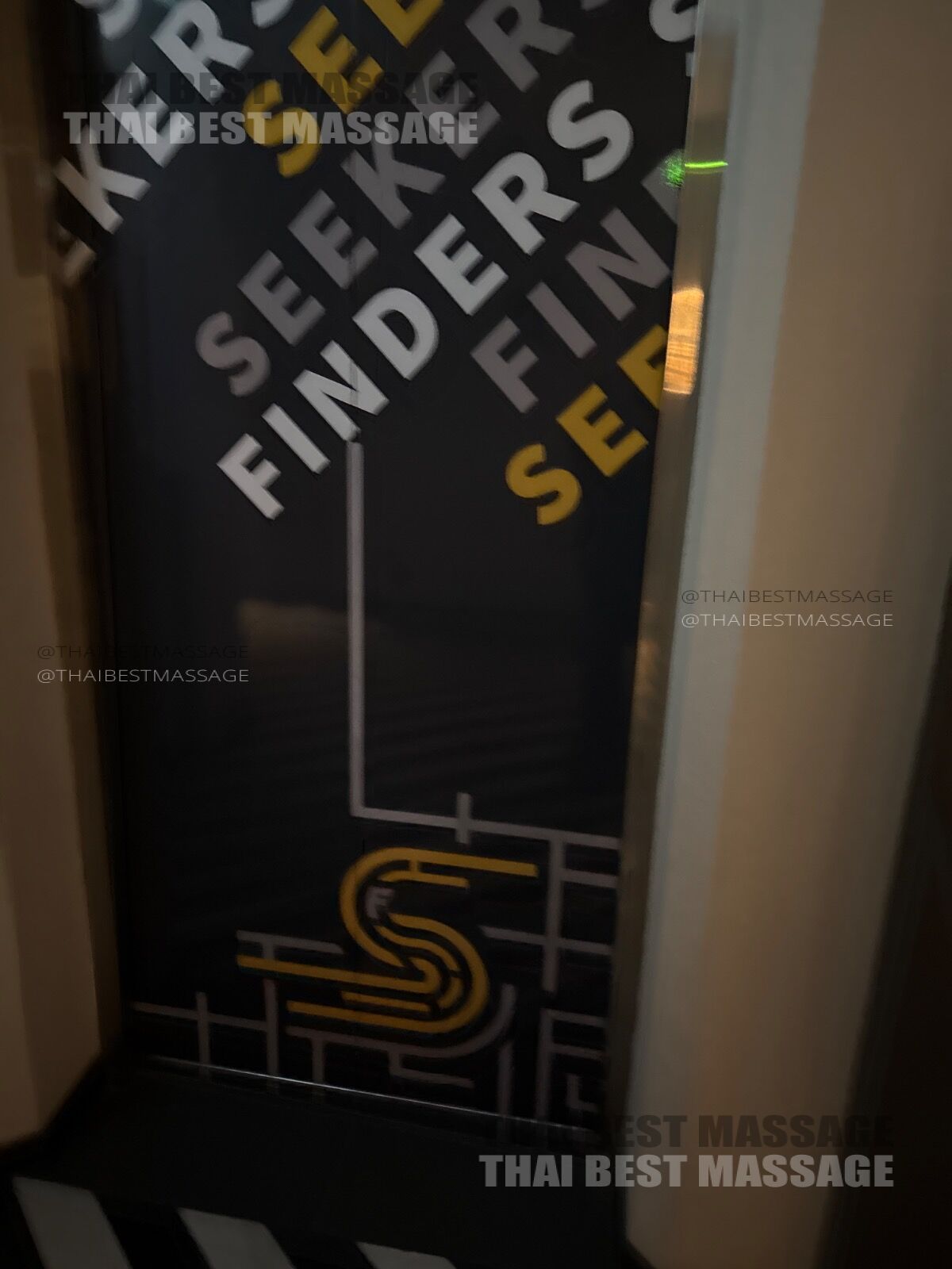 Professional massage therapist setting up for a hotel massage service in Bangkok