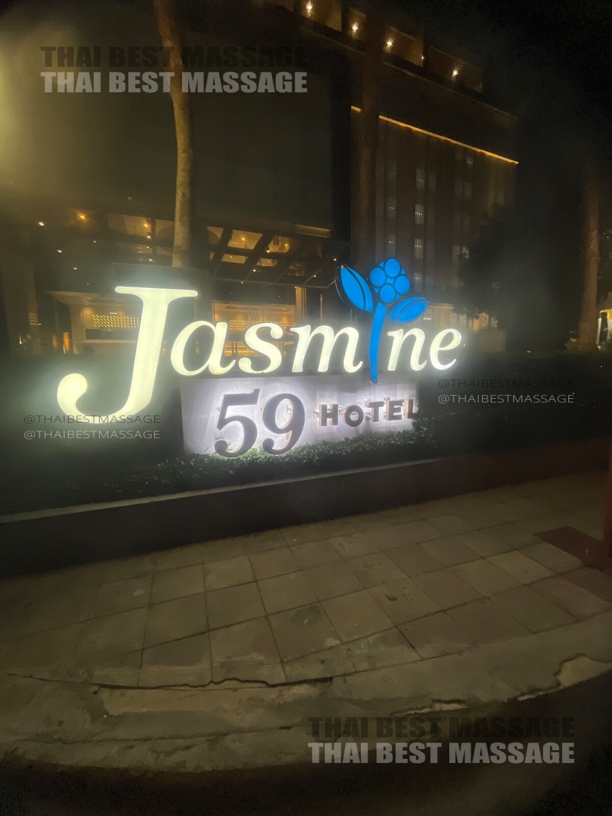 Therapist Aria preparing equipment for a mobile Thai massage session.