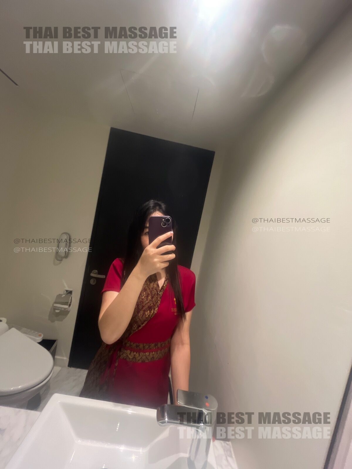 Therapist Aria providing a relaxing 2-hour Aroma Massage on the guest's bed at Crowne Plaza.